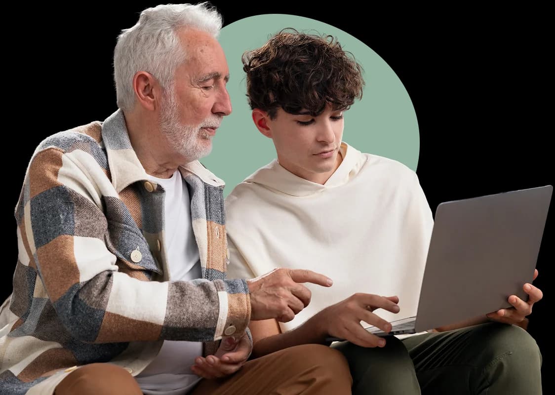 Advisor helping a beneficiary review Medicare options on a laptop
