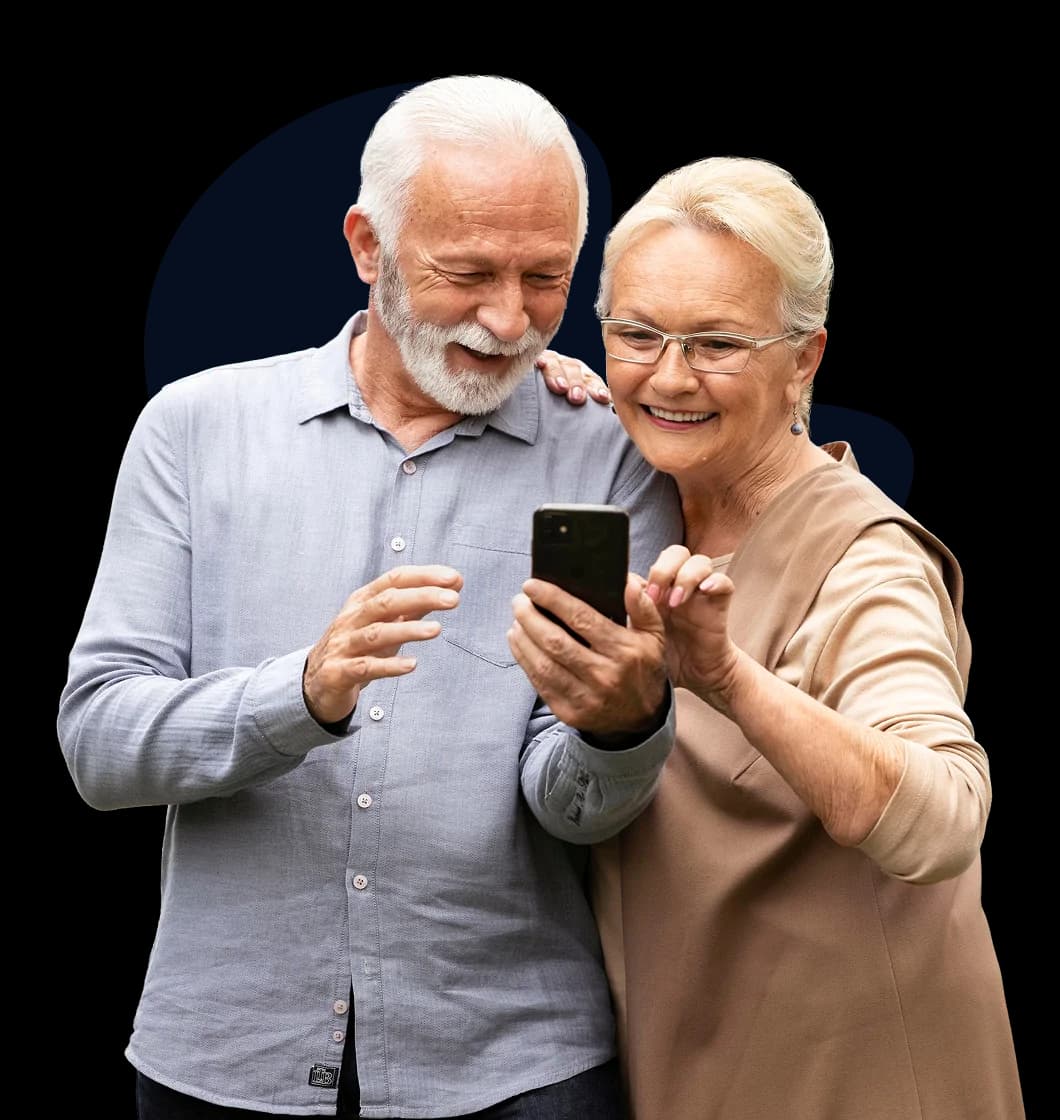 Seniors comparing Medicare options on a phone